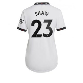 Replika Ženski nogometni dresi kompleti Manchester United Gostujoči 2022-23 Kratek Rokav Luke Shaw 23
