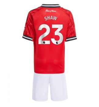 Otroški Nogometni dresi Kompleti Manchester United Luke Shaw #23 Domači 2025-26